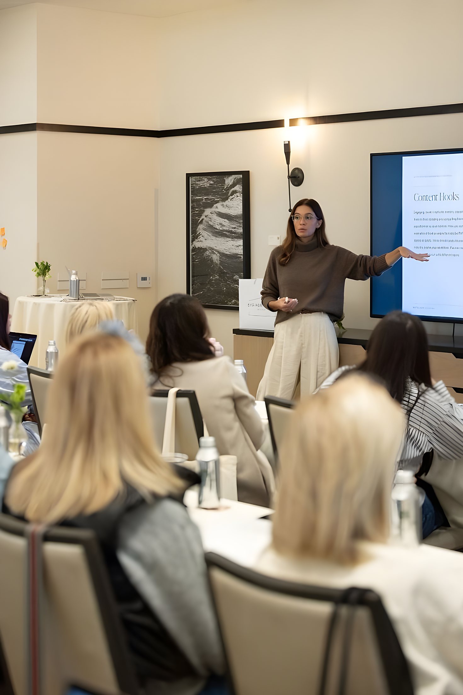 A practice management trainer presenting to a small group